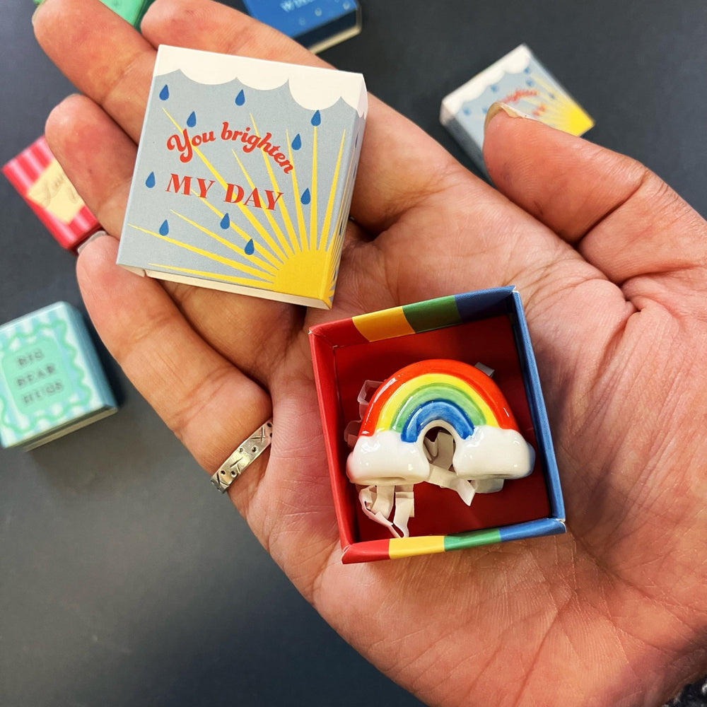 
                  
                    Tiny Matchbox Ceramic Charms - The Willoughby Book ClubYou brighten my day - Mini Ceramic Rainbow
                  
                